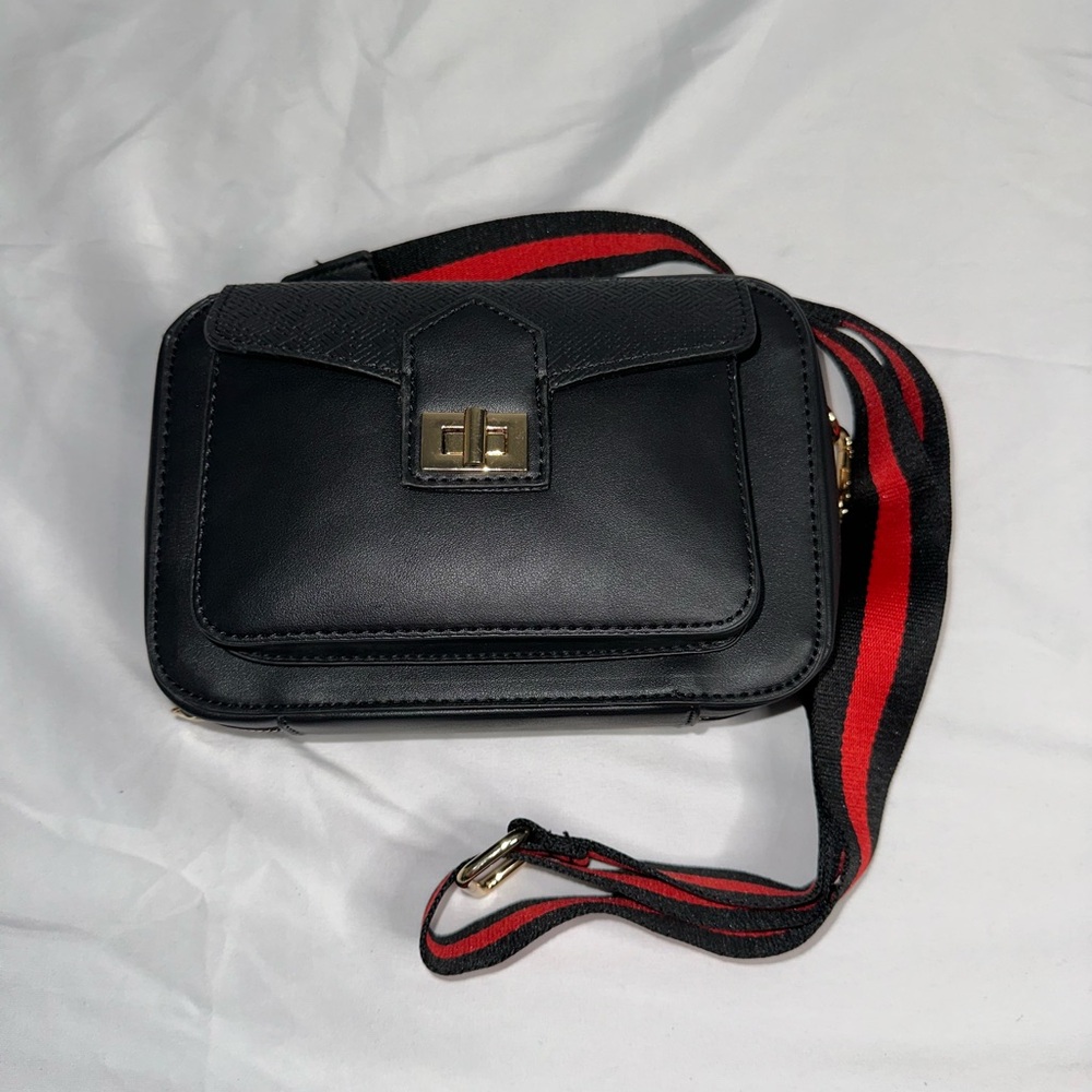 Elegant Black and Red Crossbody Bag with Gold Accents